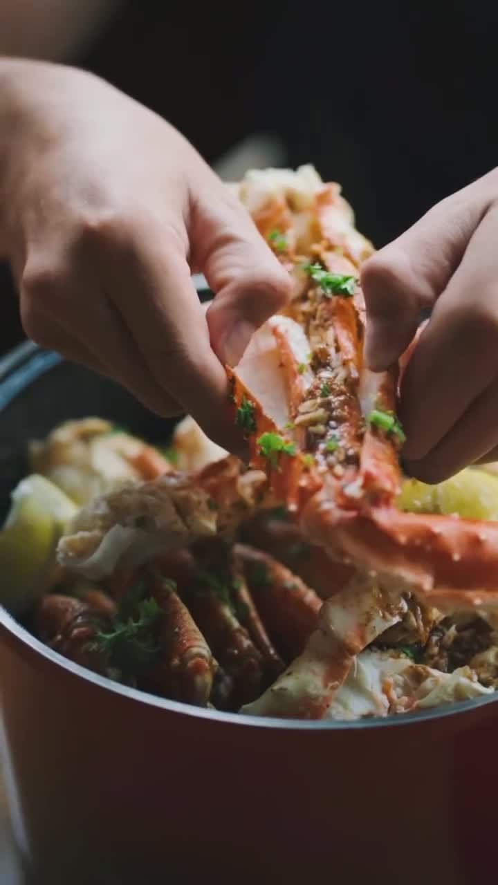 Fresh crab and seafood being cracked open at the table
