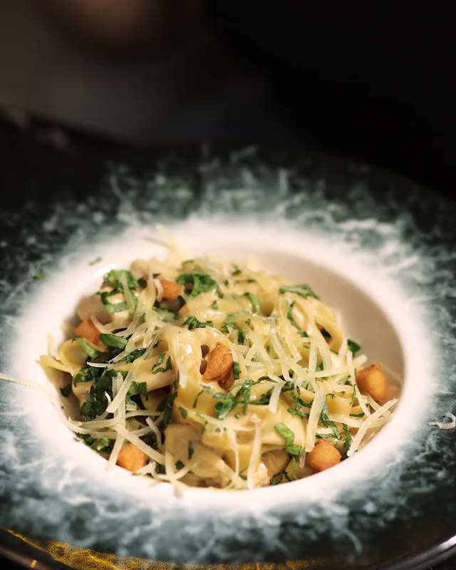 Fresh tagliatelle twirled on a fork at Zuri