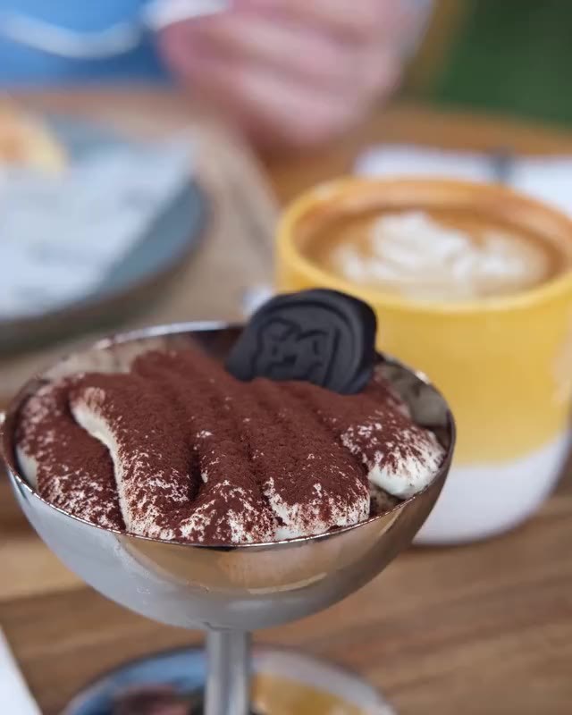 A spoon breaking into a cocoa-dusted Zurimisu'
