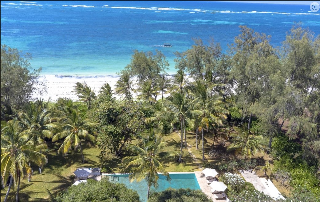 Aerial view of the beachfront and turquoise reef waters