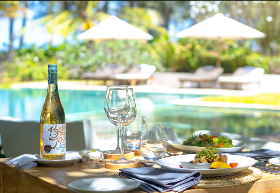 Poolside dining with chilled white wine