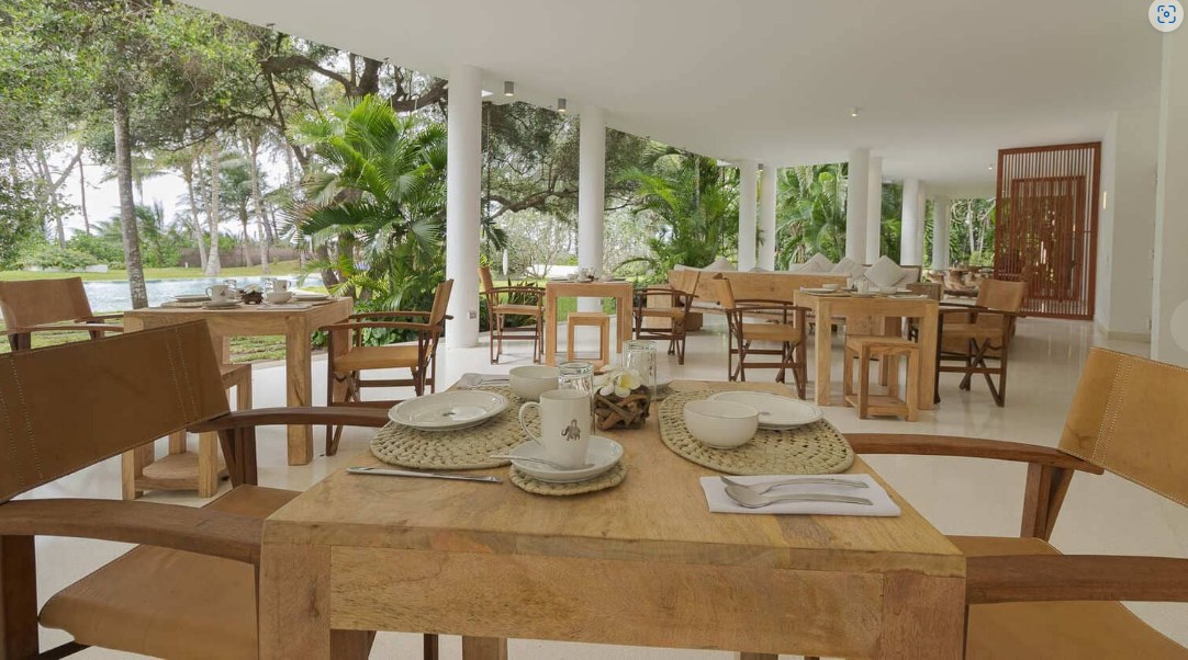 Open-air breakfast terrace overlooking the garden