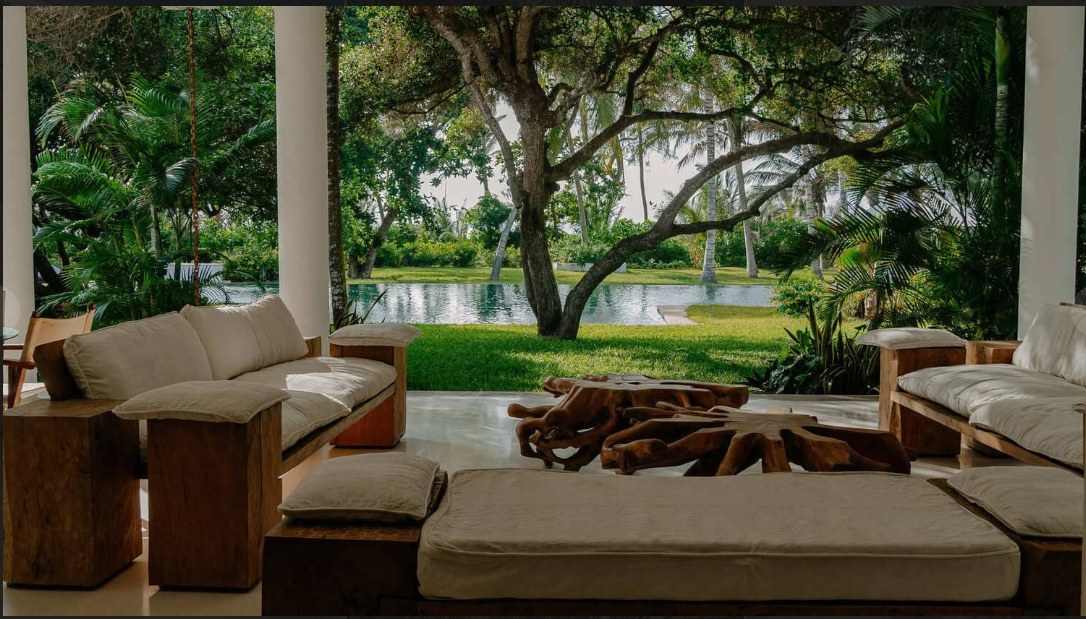Open-sided lounge at Zuri looking out to the garden and pool